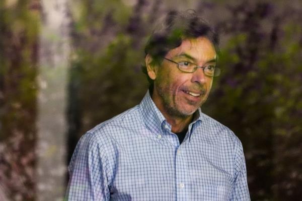 Dr. Mark Chavez, a physician from San Diego, charged in connection with actor Matthew Perry's death from an accidental ketamine overdose, is seen through a glass window as he arrives at the Roybal Federal Courthouse in Los Angeles, Friday, Aug. 30, 2024.